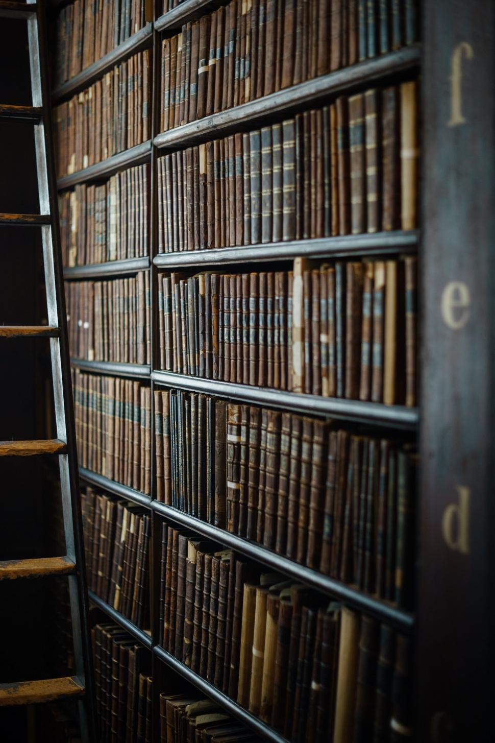 Free Image of A Book Shelf Filled With Lots of Books 