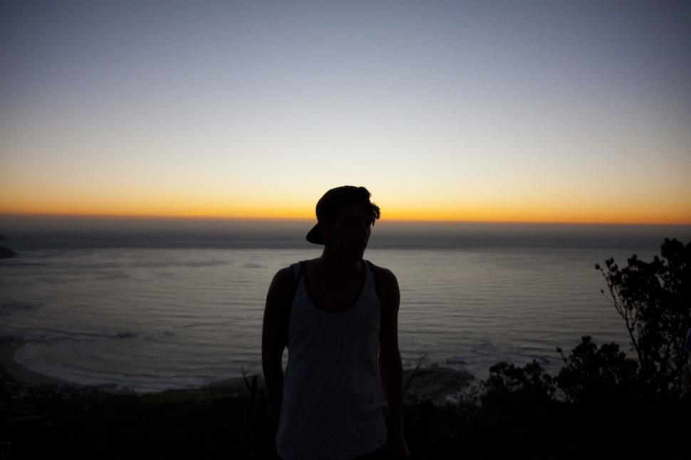 Free Image of Person Standing in Front of Body of Water 