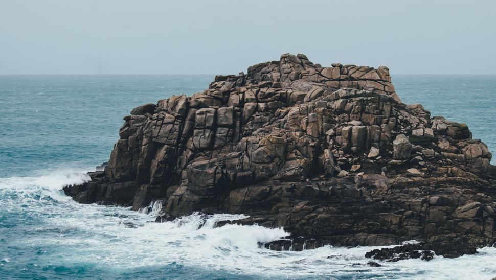 Free Image of Large Rock in Middle of Ocean 