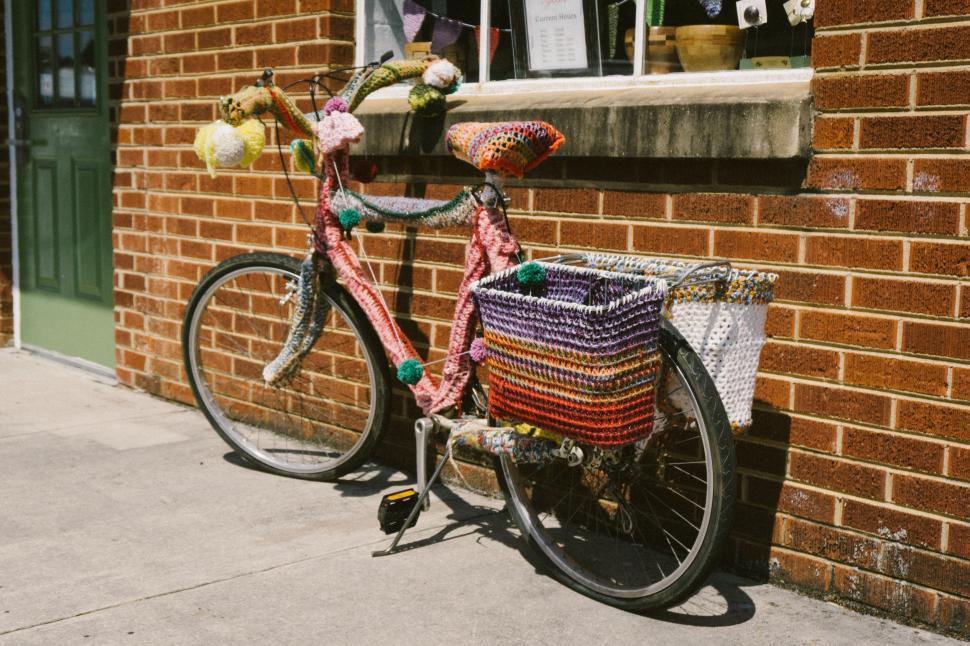 Free Image of Bicycle Parked Next to a Brick Building 