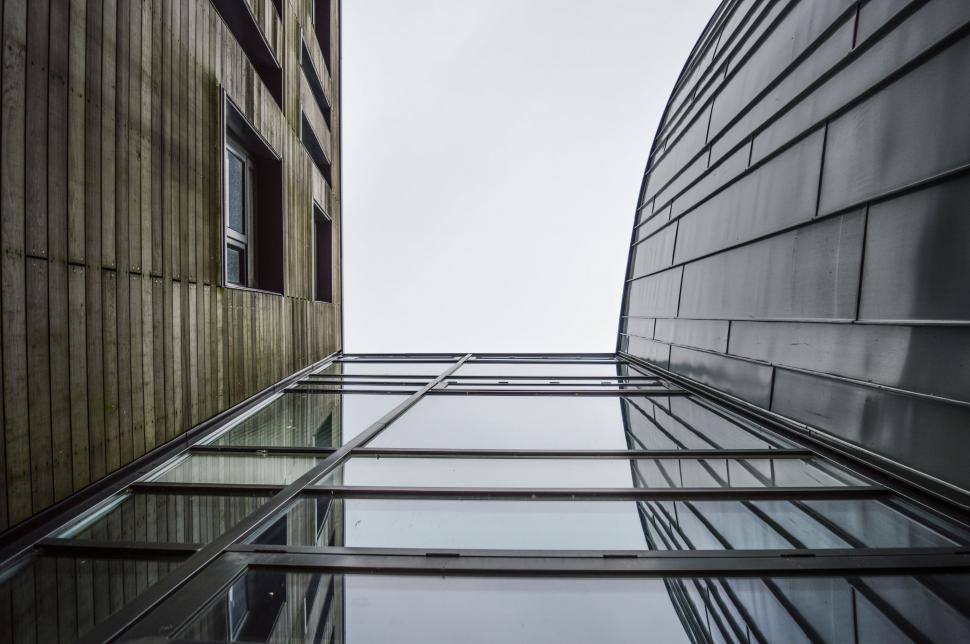 Free Image of Two Very Tall Buildings Next to Each Other 