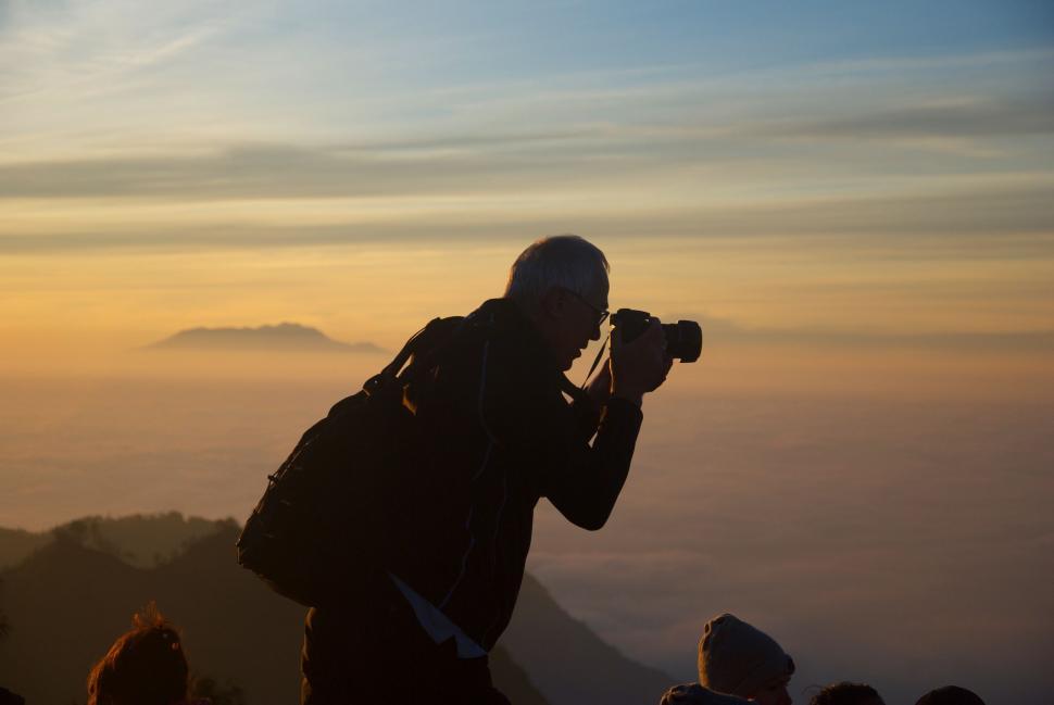 Free Image of Person Taking a Picture With a Camera 