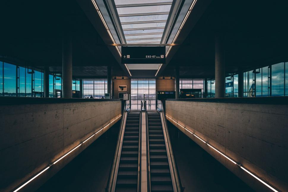 Free Image of Escalator in a Large Building With Lots of Windows 