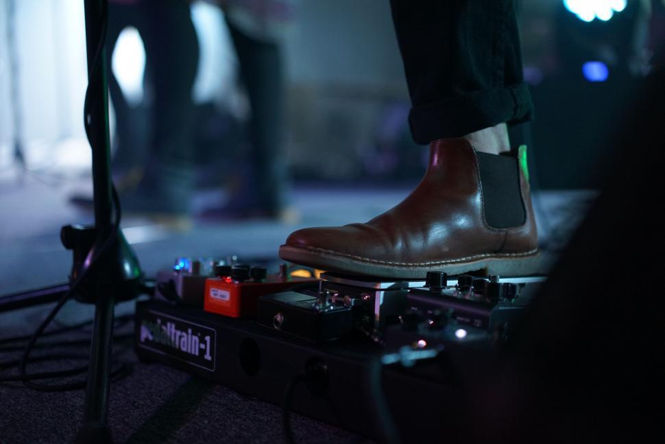 Free Image of Man Standing on Top of DJs Turntable 
