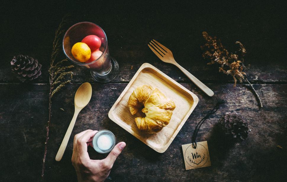 Free Image of Person Sitting at Table With Plate of Food 