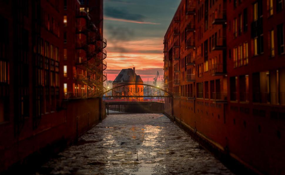 Free Image of Narrow Alley Way With Distant Bridge 