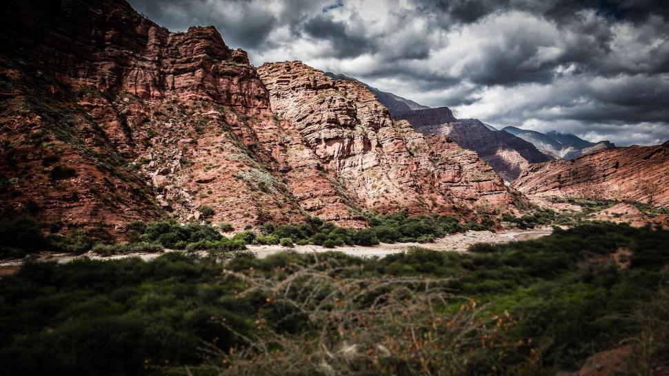 Free Image of Majestic Mountain Range Under Cloudy Sky 
