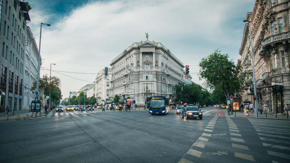 Free Image of Bustling City Street Surrounded by Tall Buildings 