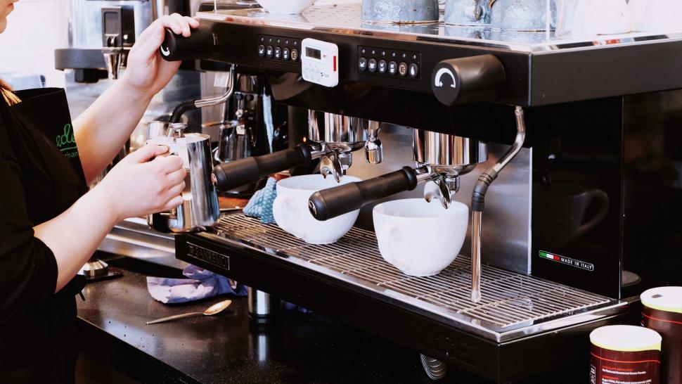 Free Image of Woman Working in a Coffee Shop 