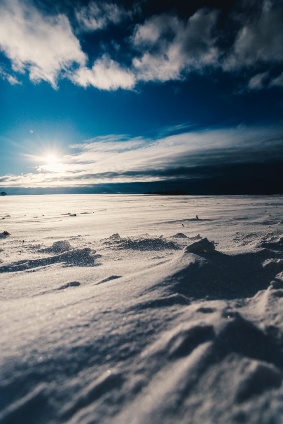 Free Image of Snowboarder Descending Icy Slope 