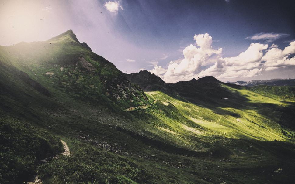 Free Image of Bright Sun Shines on Green Mountains 