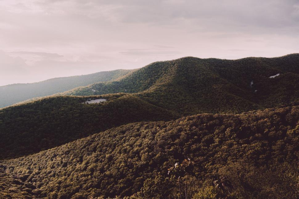 Free Image of View of a Mountain Range From the Top of a Hill 