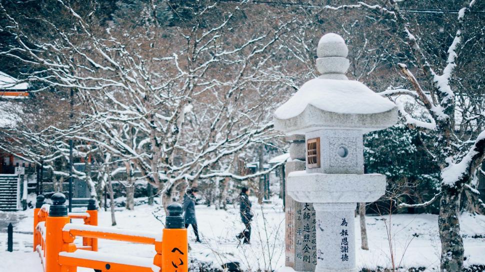 Free Image of Snow Covered Park With Statue 