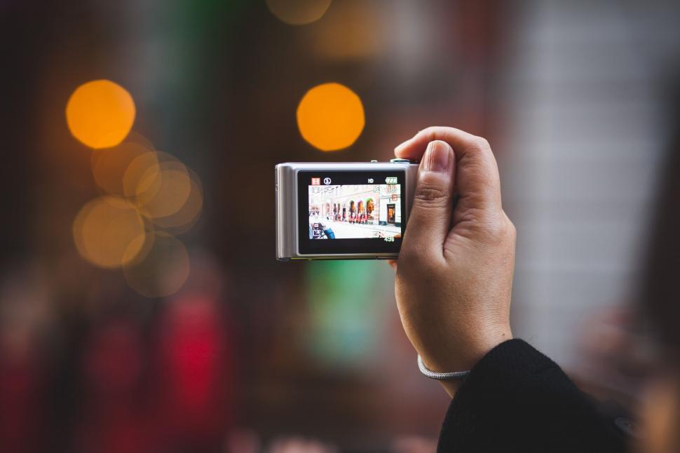 Free Image of Person Taking a Picture With a Camera 