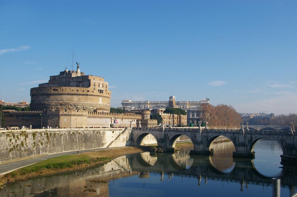 Free Image of Bridge Over Water With Castle in Background 