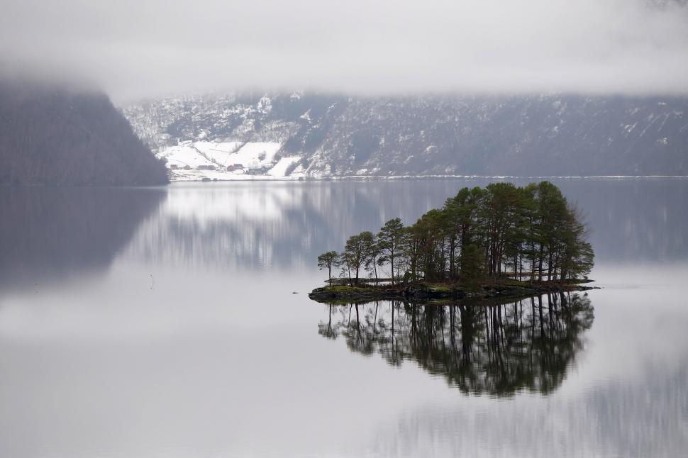 Free Image of Small Island Amidst Lake Waters 