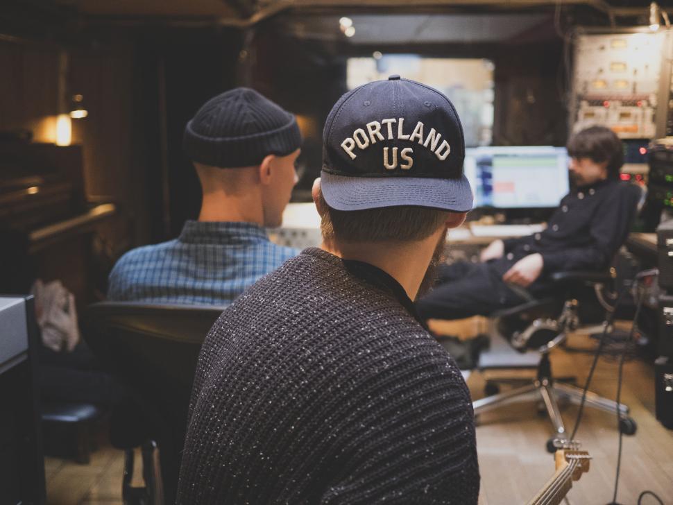Free Image of Two Men Sitting in a Room 