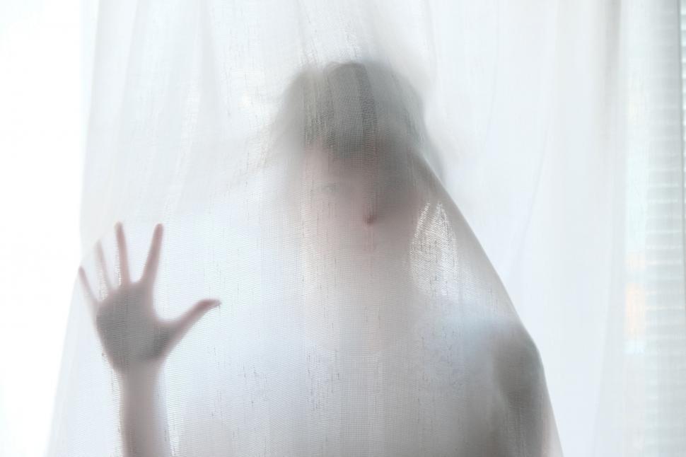 Free Image of Blurry Hand in Front of Window 