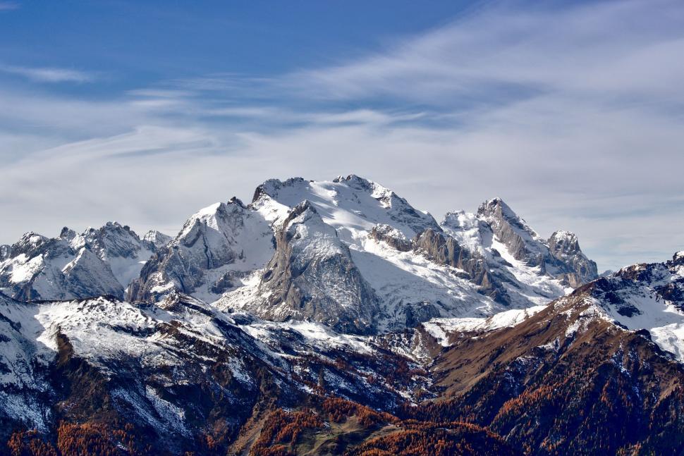 Free Image of Snow-Covered Mountain Range Under Blue Sky 