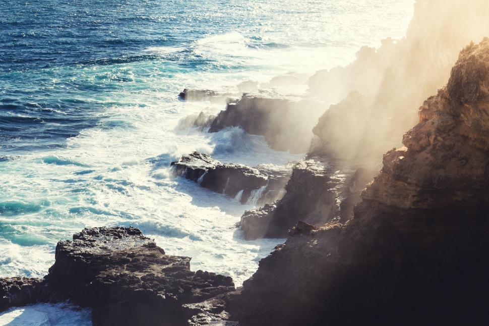 Free Image of Rocky Cliff Overlooking Body of Water 