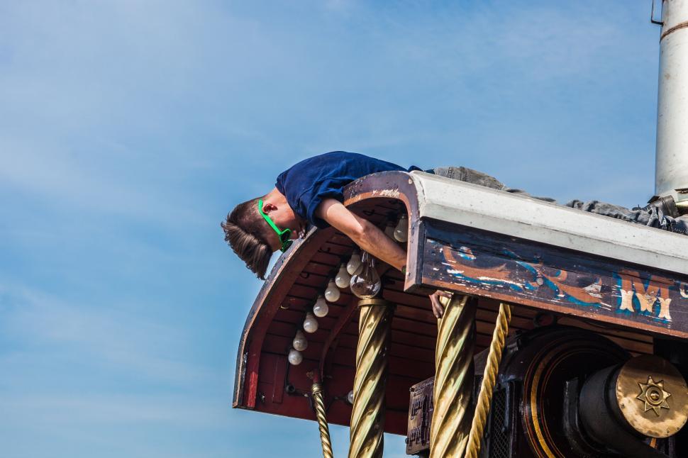 Free Image of Man Climbing Up Tall Building 