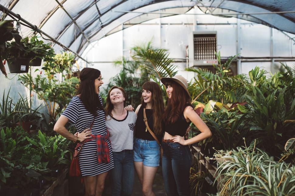 Free Image of Group of Women Standing in Greenhouse 