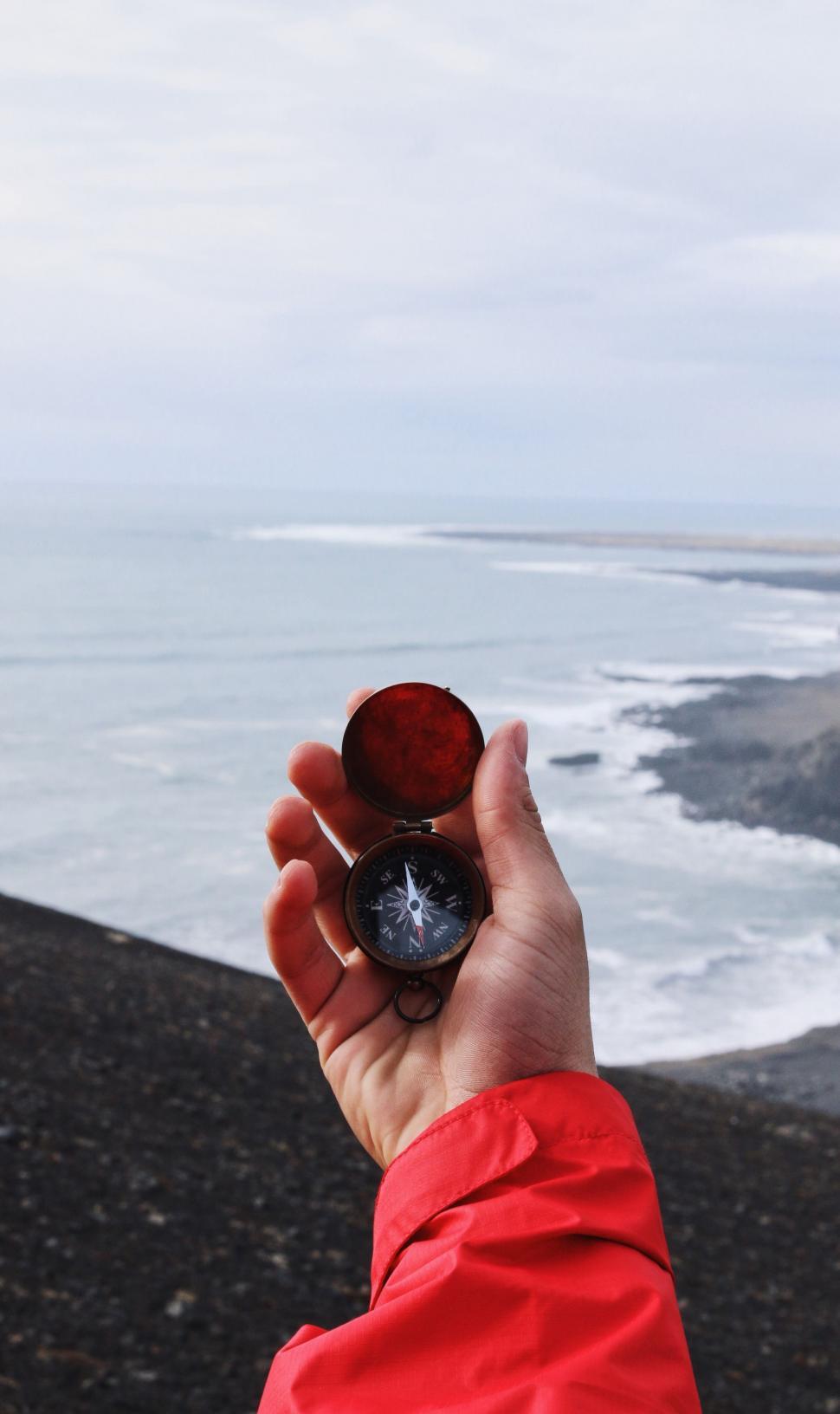 Free Image of Person Holding Small Object in Hand 