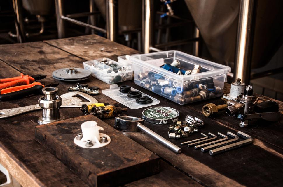 Free Image of Wooden Table Covered With Tools 