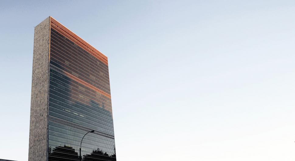 Free Image of Tall Building With Street Light 