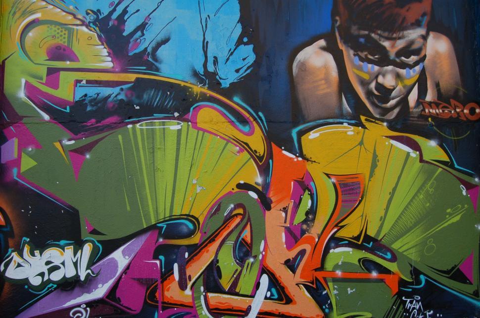 Free Image of Man Holding Tennis Racquet Painting 