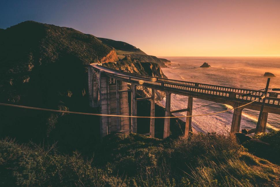 Free Image of Wooden Bridge Over a Body of Water 