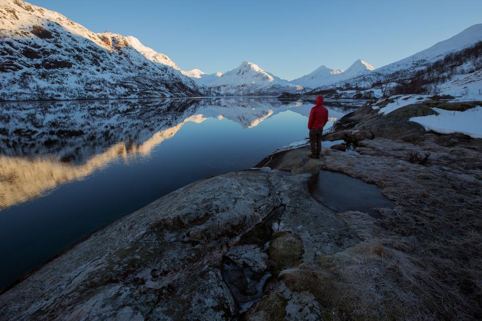 Free Image of Person Standing on Rock Near Body of Water 