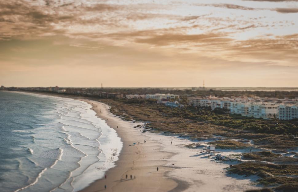 Free Image of Aerial View of Beach With Buildings in Background 
