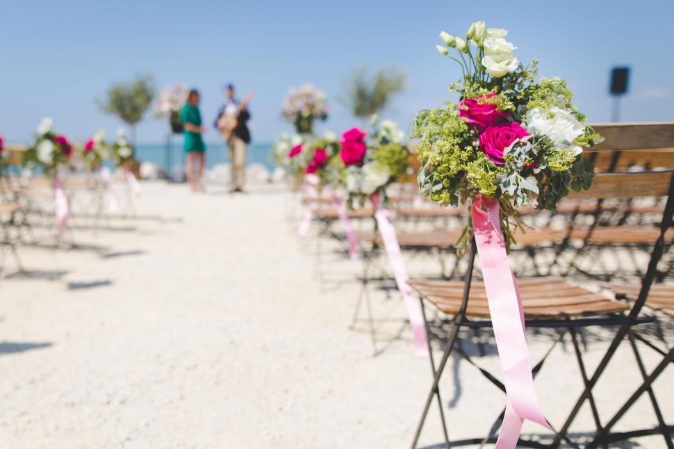 Free Image of Row of Chairs on Sandy Beach 
