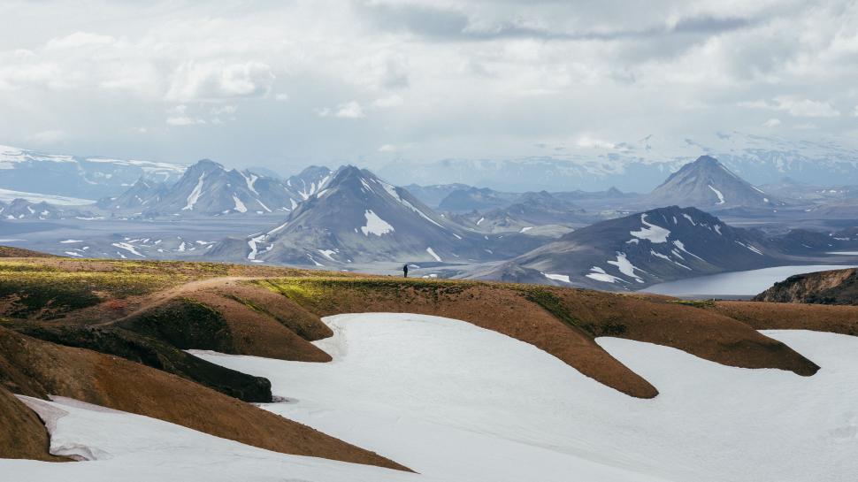 Free Image of Man Riding Snowboard Down Snow-Covered Slope 