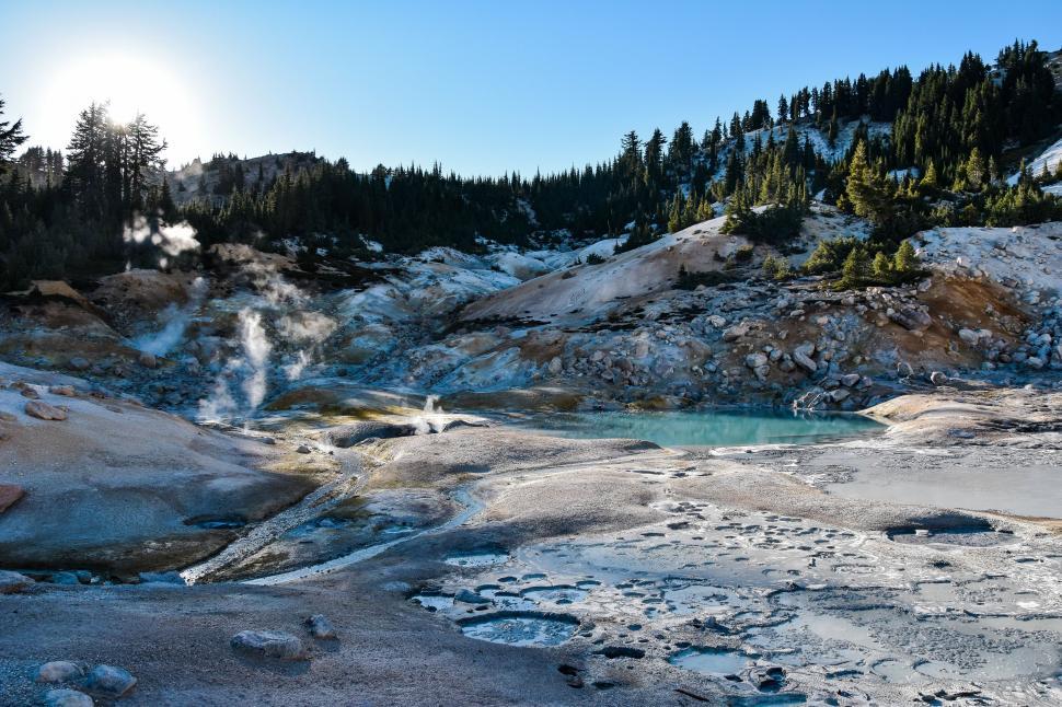 Free Image of The Sun Shines Over Snowy Mountain 