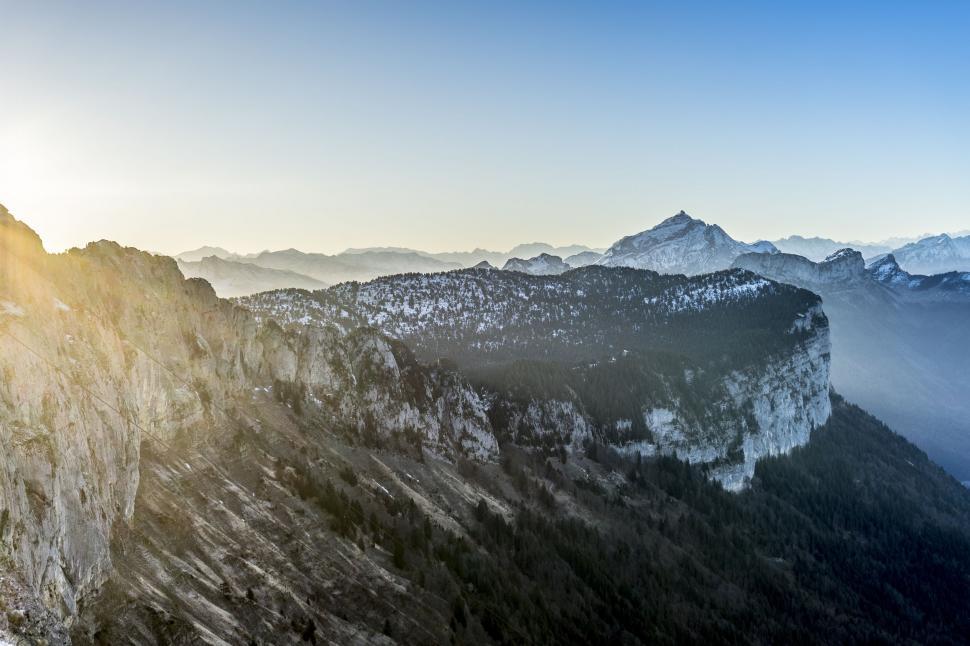Free Image of Person Standing on Top of Snow Covered Mountain 