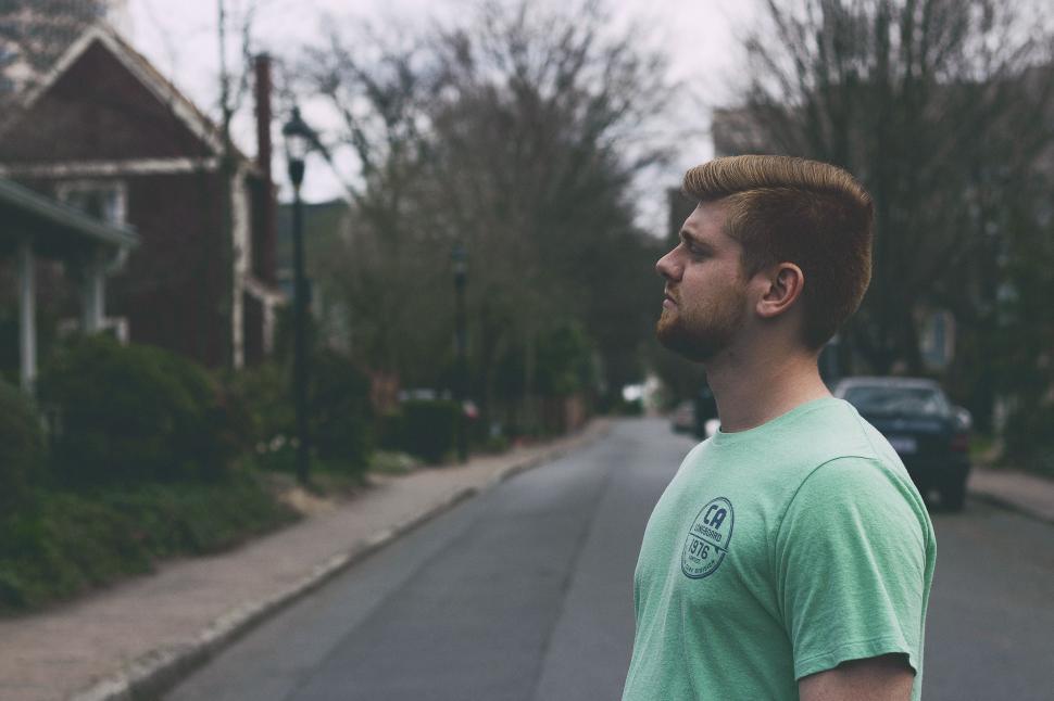 Free Image of Man Standing on the Side of a Road 