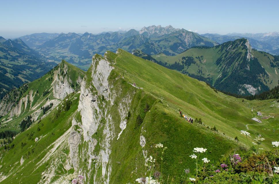 Free Image of Green Mountain Range With Background Mountains 