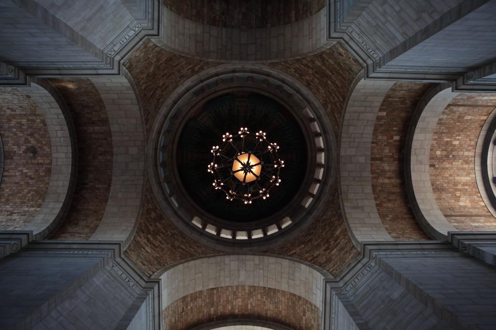 Free Image of Clock Adorning the Ceiling of a Building 