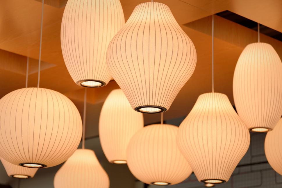 Free Image of Array of White Lamps Hanging From Ceiling 