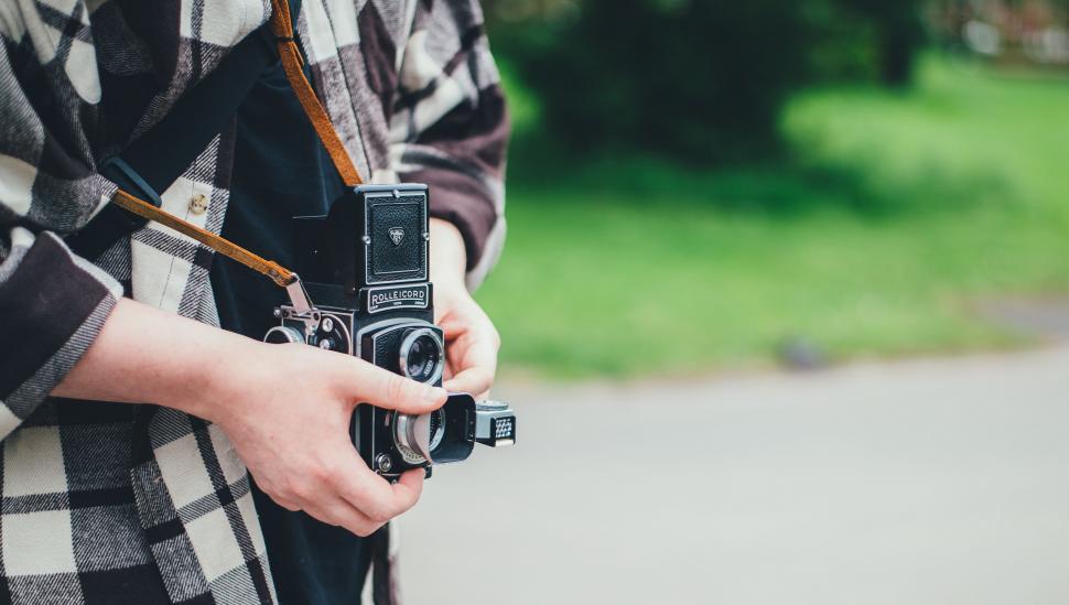 Free Image of Person Holding Camera 