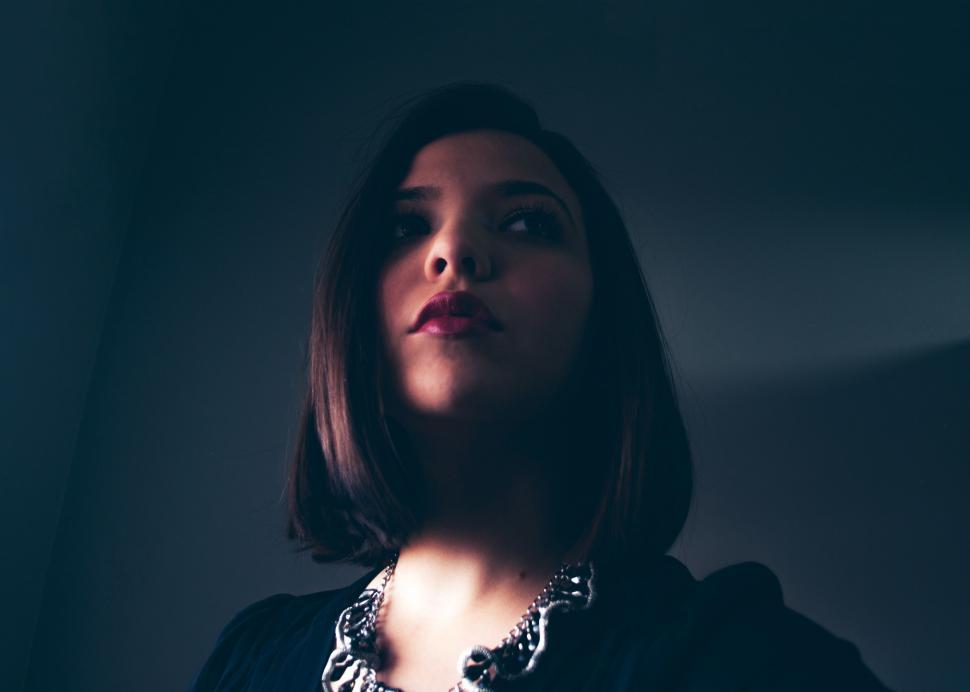Free Image of Woman in Black Shirt and Necklace 