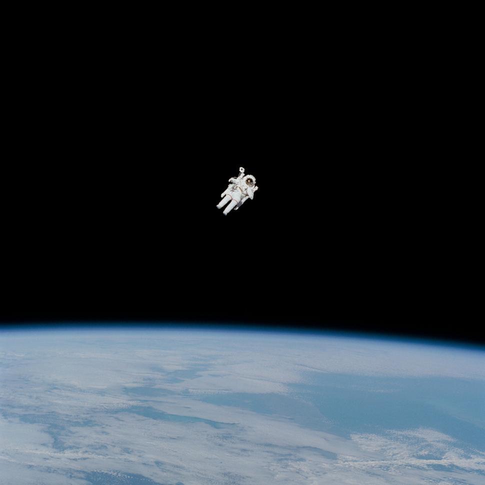 Free Image of Astronaut Floating Above Earth 