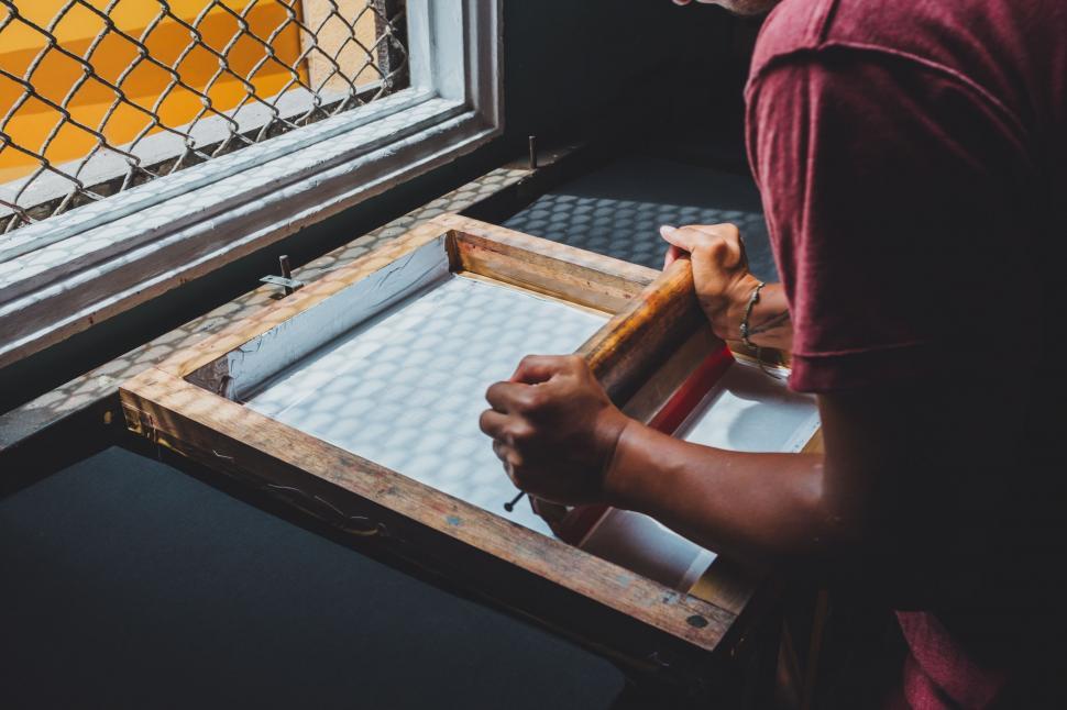 Free Image of Man Carving Wood With Chisel 