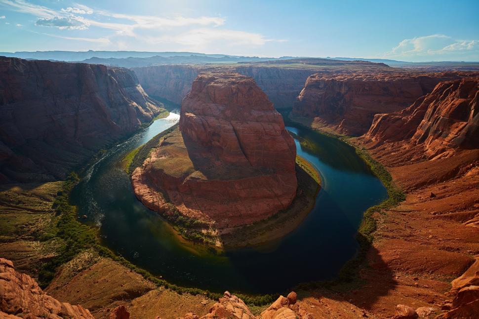 Free Image of River Flowing Through Canyon Surrounded by Mountains 