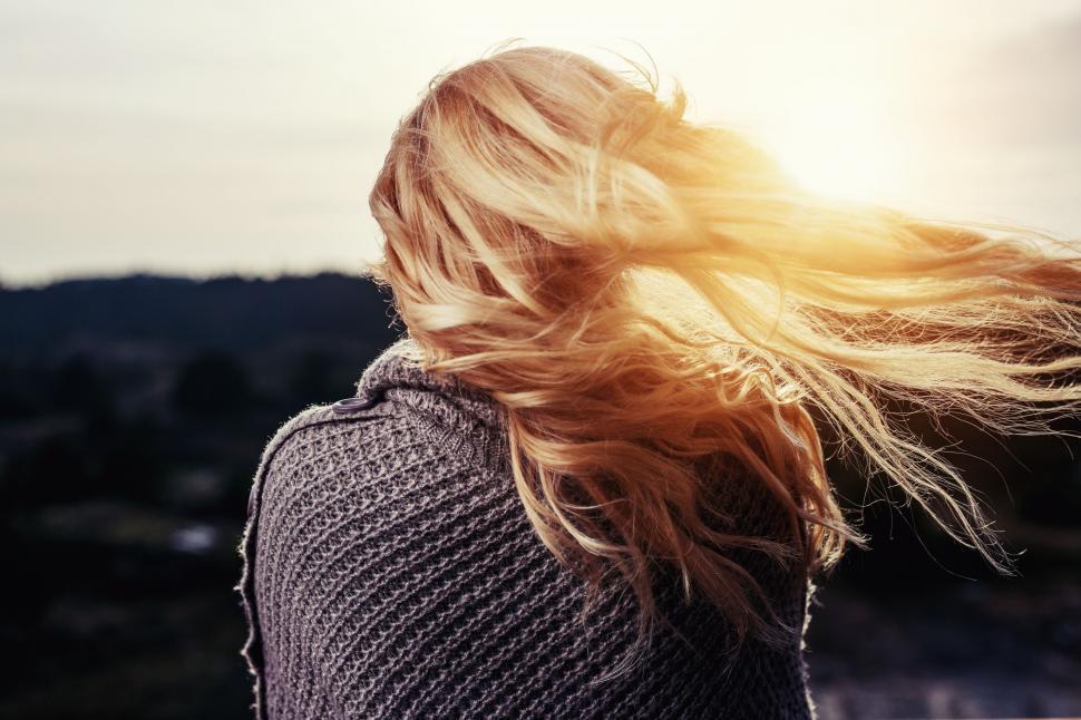 Free Image of Woman With Hair Blowing in the Wind 