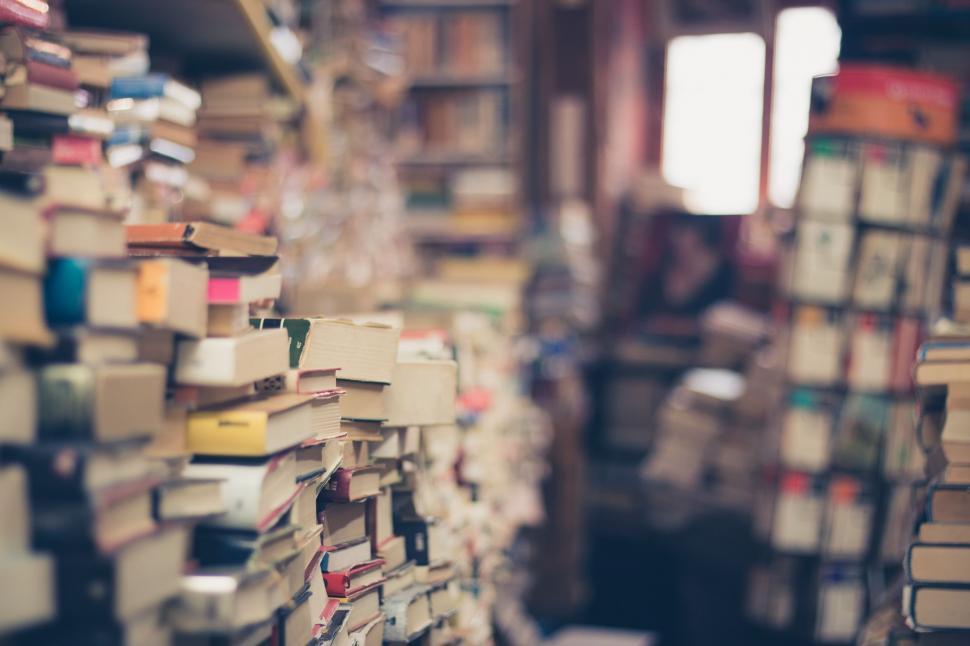 Free Image of Room Filled With Books Next to Window 