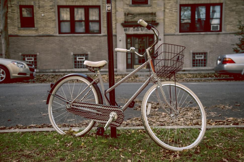 Free Image of Bicycle Parked on the Side of a Street 
