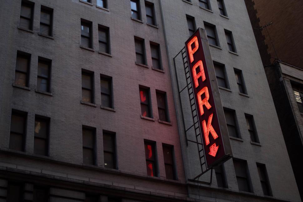 Free Image of Neon Sign Illuminating Building Façade 